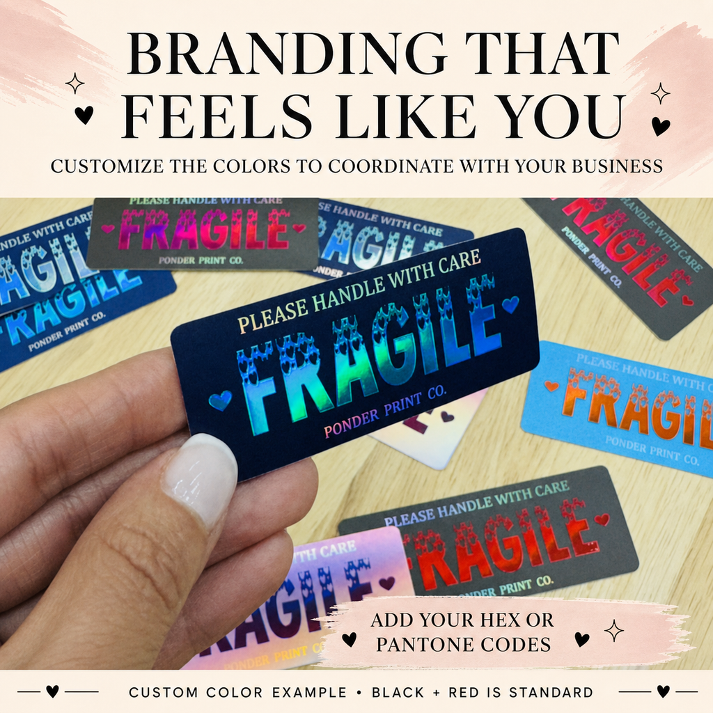 A hand holds a custom printed black FRAGILE card with a blue-to-pink gradient logo, surrounded by other colorful FRAGILE Sticker Text overlays describe customizable colors and branding.