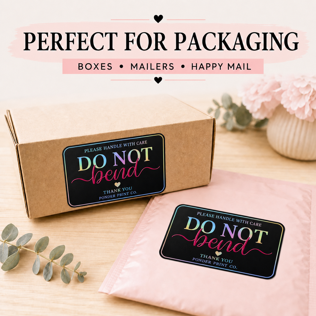 A kraft paper shipping box and a light pink mailer envelope, both printed with a matching 'DO NOT bend' label, arranged on a light wood surface with decorative flowers and eucalyptus stems. Text at the top reads 'PERFECT FOR PACKAGING' with 'BOXES • MAILERS • HAPPY MAIL'.