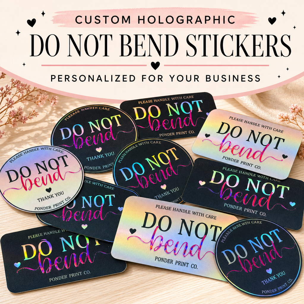 A set of custom holographic 'DO NOT BEND' stickers displayed on a light beige fabric background. The stickers feature a black base with a vibrant iridescent rainbow holographic foil effect, with text reading 'DO NOT BEND', 'PLEASE HANDLE WITH CARE', and 'THANK YOU' in pink, blue, and purple.